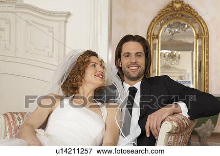 young bridal couple sitting together, portrait of young man View Large Photo Image Stock Photo - young bridal couple sitting together, portrait of young man. Fotosearch