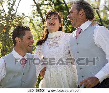 Young bride and groom and mature father jumping, smiling View Large Photo Image Stock Image - Young bride and groom and mature father jumping, smiling. Fotosearch