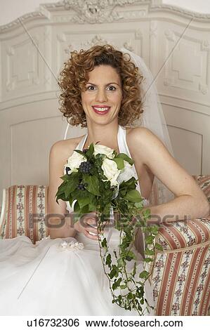 young bride holding bridal bouquet, portrait View Large Photo Image Stock Photograph - young bride holding bridal bouquet, portrait. Fotosearch