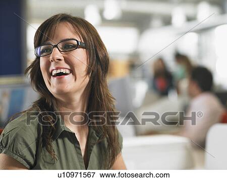 Businesswoman working in an office View Large Photo Image Stock Photo - Businesswoman working in an office. Fotosearch
