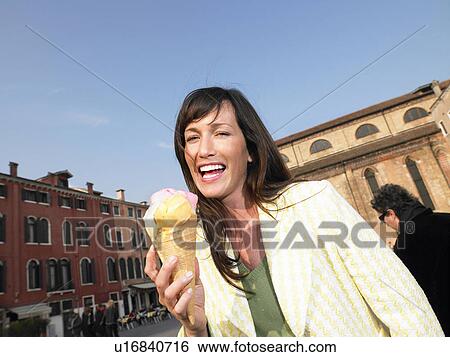 Woman eating ice cream. Venice, Italy. View Large Photo Image Stock Photograph - Woman eating ice cream. Venice, Italy.. Fotosearch