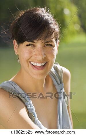Woman smiling outdoors View Large Photo Image Stock Photography - Woman smiling outdoors. Fotosearch