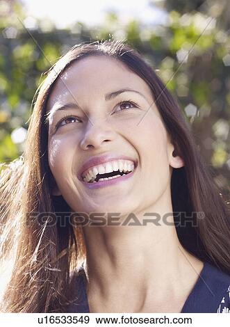 Young woman laughing View Large Photo Image Stock Photo - Young woman laughing. Fotosearch
