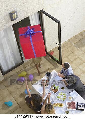 Stock Photo - Arriving with gifts to the party . Fotosearch