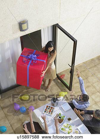 Arriving with gifts to the party View Large Photo Image Stock Photo - Arriving with gifts to the party . Fotosearch