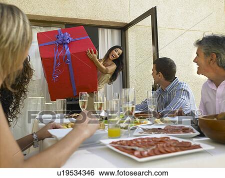 Arriving with gifts to the party View Large Photo Image Stock Photograph - Arriving with gifts to the party . Fotosearch
