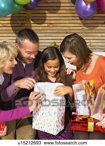 Girl (8-10) opening presents View Large Photo Image Stock Image - Girl (8-10) opening presents. Fotosearch