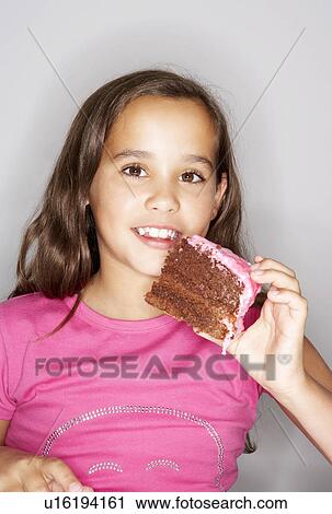Girl holding large slice of cake View Large Photo Image Stock Image - Girl holding large slice of cake. Fotosearch