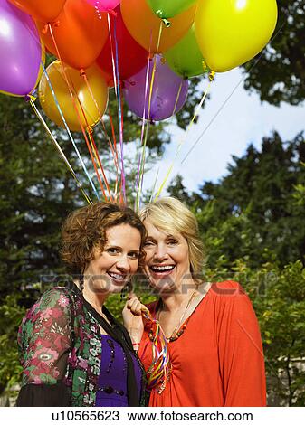 Stock Image - Mature woman and younger woman. Fotosearch