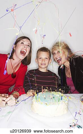 Women and boy with birthday cake View Large Photo Image Stock Photo - Women and boy with birthday cake. Fotosearch