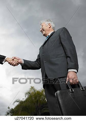 Businessmen shaking hands. View Large Photo Image Stock Image - Businessmen shaking hands.. Fotosearch
