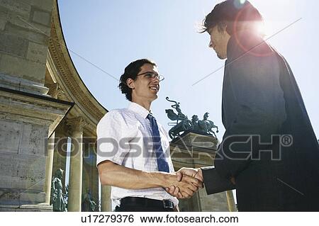 Stock Photograph - Businessmen shaking hands.. Fotosearch