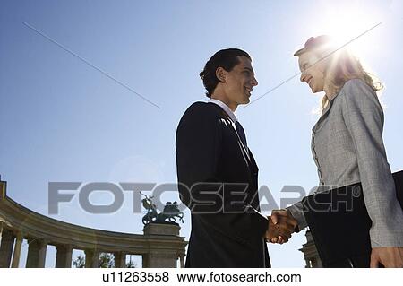 Stock Photo - Businesspeople shaking hands.. Fotosearch