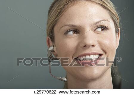 Close-Up portrait of Business woman with telephone headset / earpiece. View Large Photo Image Stock Image - Close-Up portrait of Business woman with telephone headset / earpiece.. Fotosearch