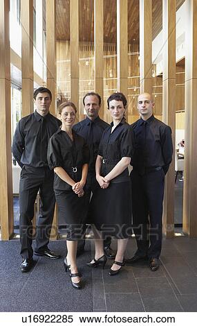 Stock Photography - Hotel staff posing together. Fotosearch
