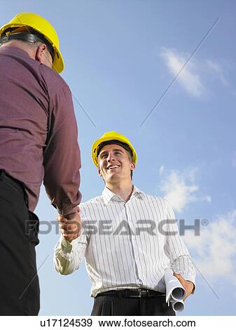 Surveyors on a field. View Large Photo Image Stock Photo - Surveyors on a field.. Fotosearch