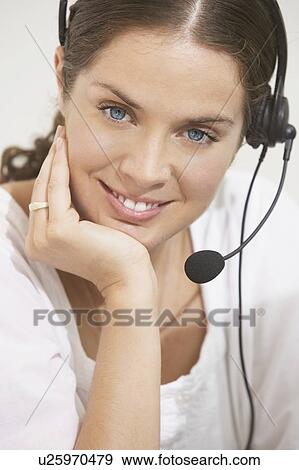 Woman with telephone headset smiling. View Large Photo Image Stock Photo - Woman with telephone headset smiling.. Fotosearch
