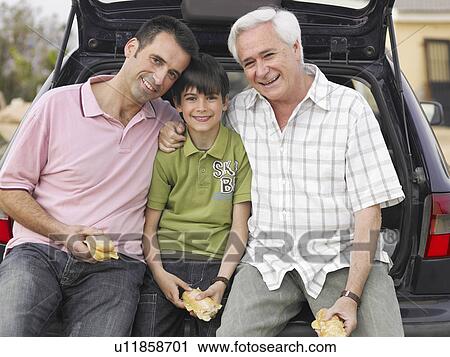 Boy (8-10) resting against boot of car with father and grandfather, portrait View Large Photo Image Stock Image - Boy (8-10) resting against boot of car with father and grandfather, portrait. Fotosearch