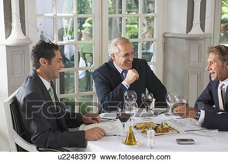 Three businessmen having lunch View Large Photo Image Stock Photo - Three businessmen having lunch. Fotosearch