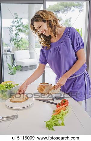 Woman in kitchen. View Large Photo Image Stock Photo - Woman in kitchen.. Fotosearch