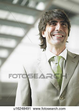 Stock Image - Businessman in an office. Fotosearch