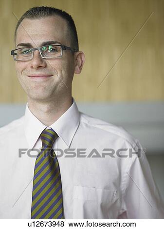 Businessman in an office View Large Photo Image Stock Photo - Businessman in an office. Fotosearch