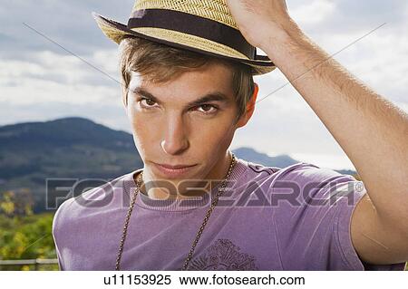 Man wearing hat hand on head. View Large Photo Image Stock Photography - Man wearing hat hand on head.. Fotosearch