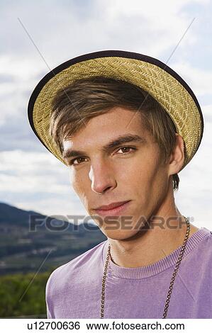 Portrait of man wearing straw hat. View Large Photo Image Stock Photograph - Portrait of man wearing straw hat.. Fotosearch