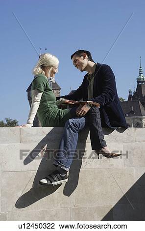 Couple with a guitar outdoors smiling. View Large Photo Image Stock Image - Couple with a guitar outdoors smiling.. Fotosearch