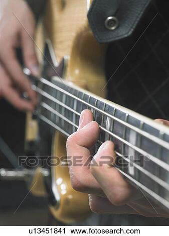 One electric guitar player close up on hands. View Large Photo Image Stock Image - One electric guitar player close up on hands.. Fotosearch