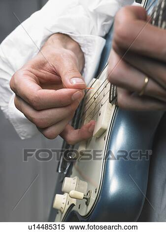 One electric guitar player close up on hands. View Large Photo Image Stock Photography - One electric guitar player close up on hands.. Fotosearch