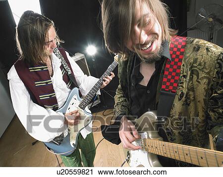 Two electric guitar players in studio. View Large Photo Image Stock Image - Two electric guitar players in studio.. Fotosearch