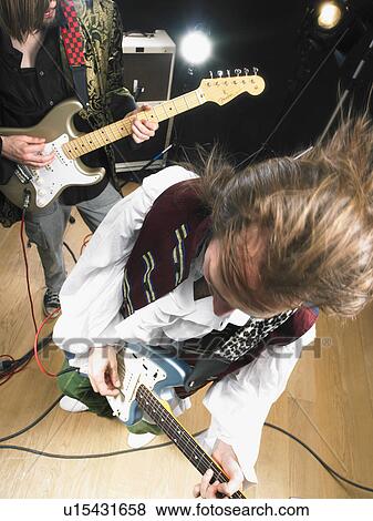 Stock Photo - Two electric guitar players in studio.. Fotosearch