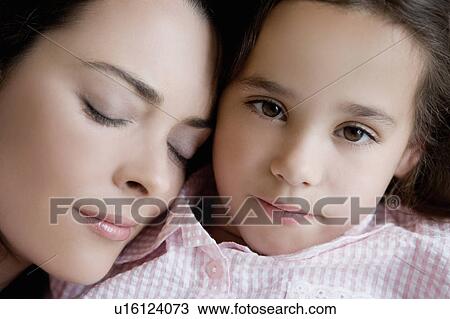 Portrait of mother and daughter in bed. View Large Photo Image Stock Image - Portrait of mother and daughter in bed.. Fotosearch