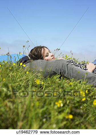 You couple lying in the grass. View Large Photo Image Stock Photo - You couple lying in the grass.. Fotosearch