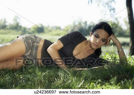 Young women reading a book. View Large Photo Image Stock Photo - Young women reading a book.. Fotosearch