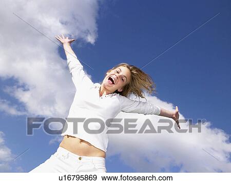 Girl jumping in the air. View Large Photo Image Stock Photo - Girl jumping in the air.. Fotosearch