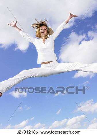 Girl jumping in the air. View Large Photo Image Stock Photography - Girl jumping in the air.. Fotosearch