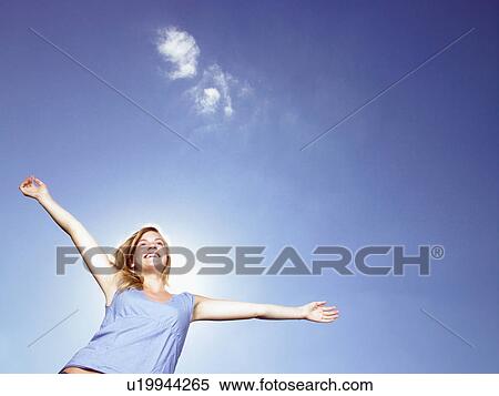 Stock Photography - Girl with arms wide open.. Fotosearch