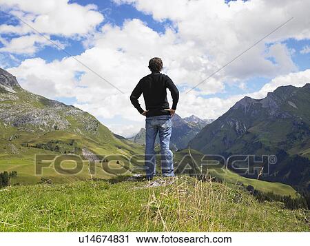 Man looking at mountains. View Large Photo Image Stock Image - Man looking at mountains.. Fotosearch