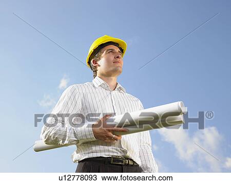 Surveyor in front of blue skies. View Large Photo Image Stock Image - Surveyor in front of blue skies.. Fotosearch