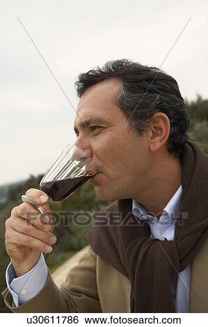 Stock Photograph - Man drinking wine. Fotosearch