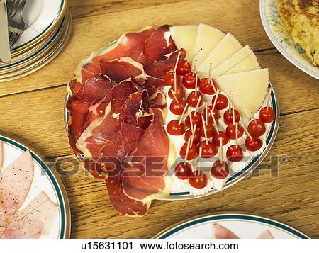 Plate of cured ham and cheese on table, close-up View Large Photo Image Stock Image - Plate of cured ham and cheese on table, close-up. Fotosearch