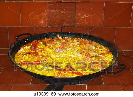 Seafood paella in large pan, close-up View Large Photo Image Stock Photo - Seafood paella in large pan, close-up. Fotosearch