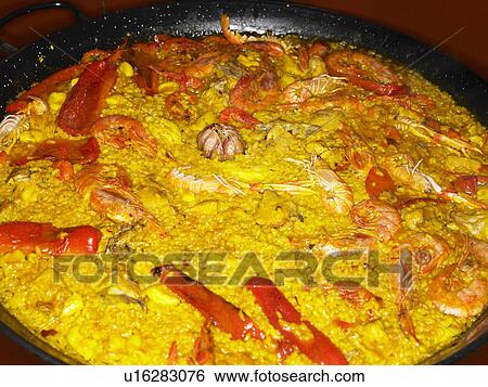 Seafood paella in large pan, close-up View Large Photo Image Stock Photograph - Seafood paella in large pan, close-up. Fotosearch