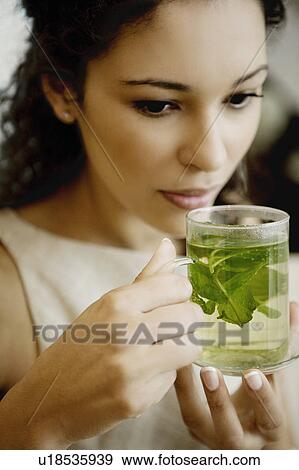 Woman drinking herbal tea. View Large Photo Image Stock Photo - Woman drinking herbal tea.. Fotosearch