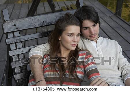 Couple embracing on a deck. View Large Photo Image Stock Photography - Couple embracing on a deck.. Fotosearch