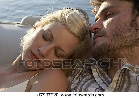 Couple sleeping in a raft. View Large Photo Image Stock Image - Couple sleeping in a raft.. Fotosearch