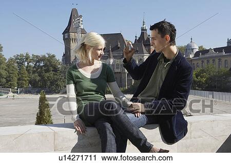 Couple taking a picture outdoors. View Large Photo Image Stock Image - Couple taking a picture outdoors.. Fotosearch