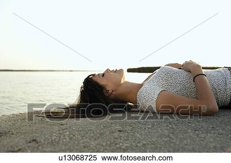 Girl sleeping by lake. View Large Photo Image Stock Photography - Girl sleeping by lake.. Fotosearch